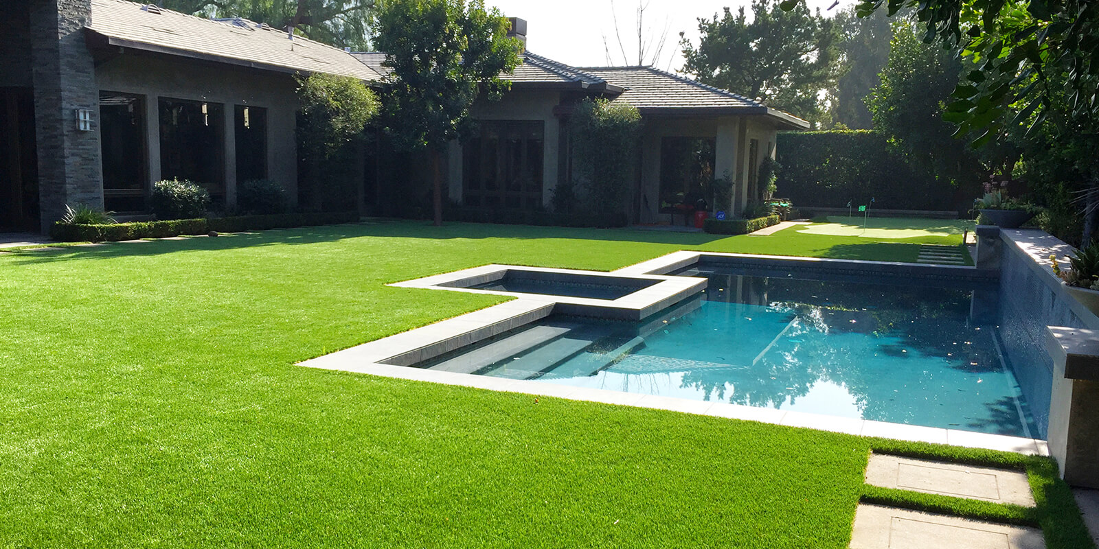 TSE_Slider_02L Backyard with artificial turf and a small pool