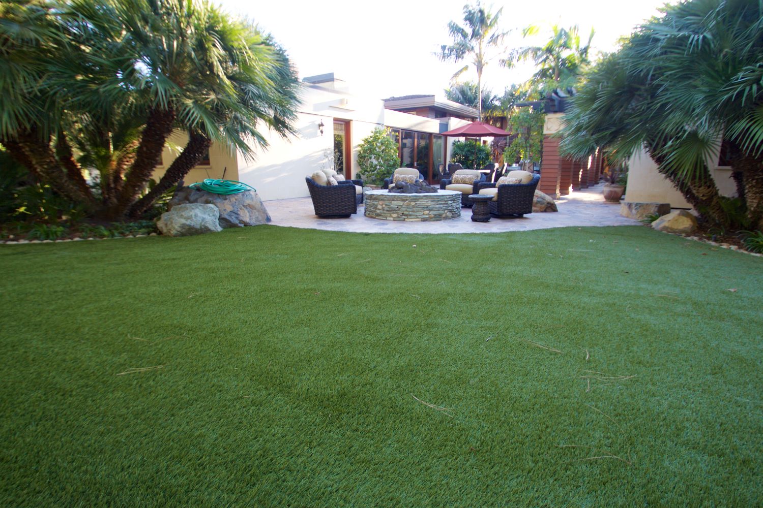 ca-artifical-turf-home Artificial grass patio with a seating area