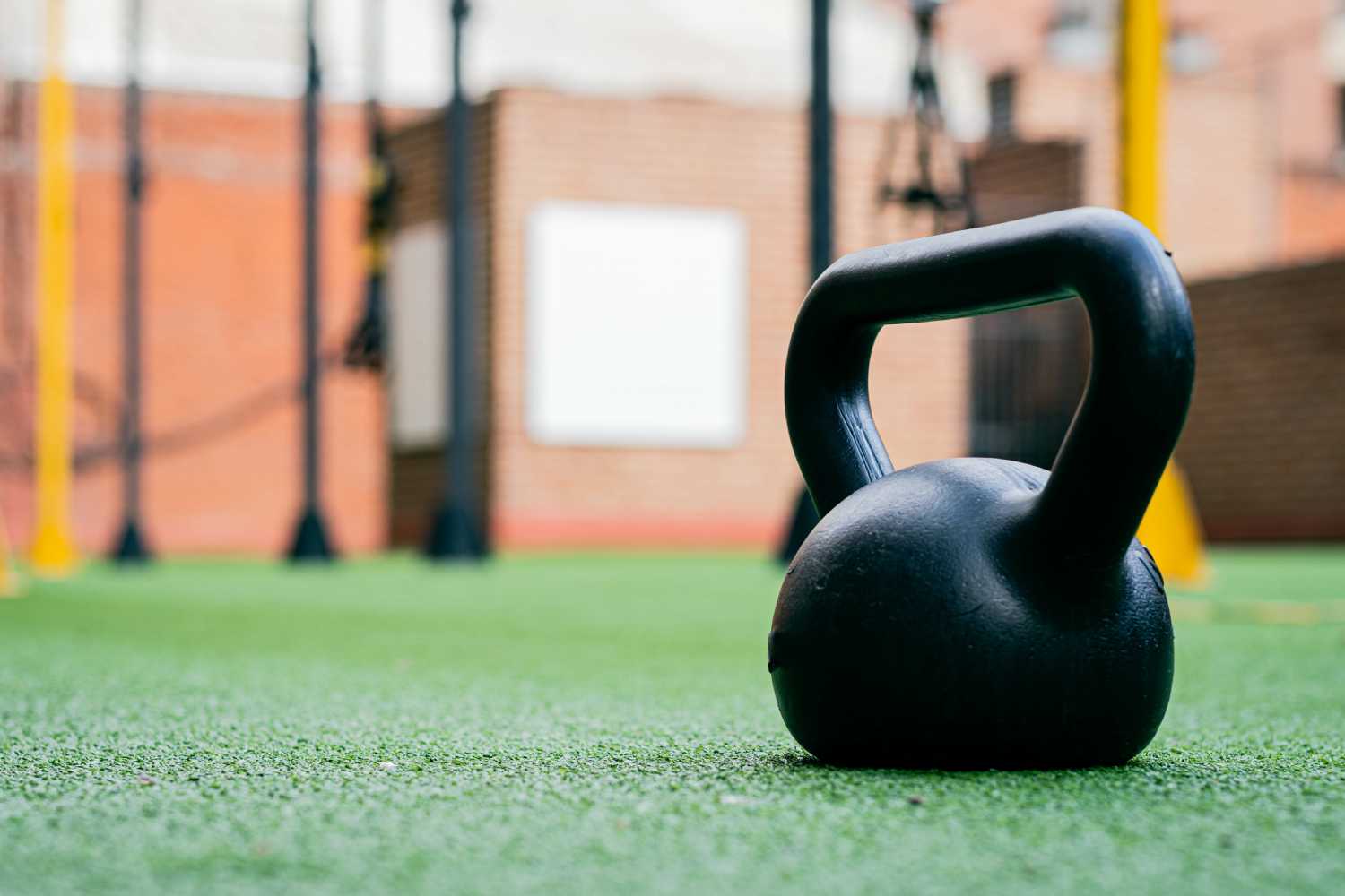 kettle-bell-artificial-grass Kettle bell on Artificial Grass